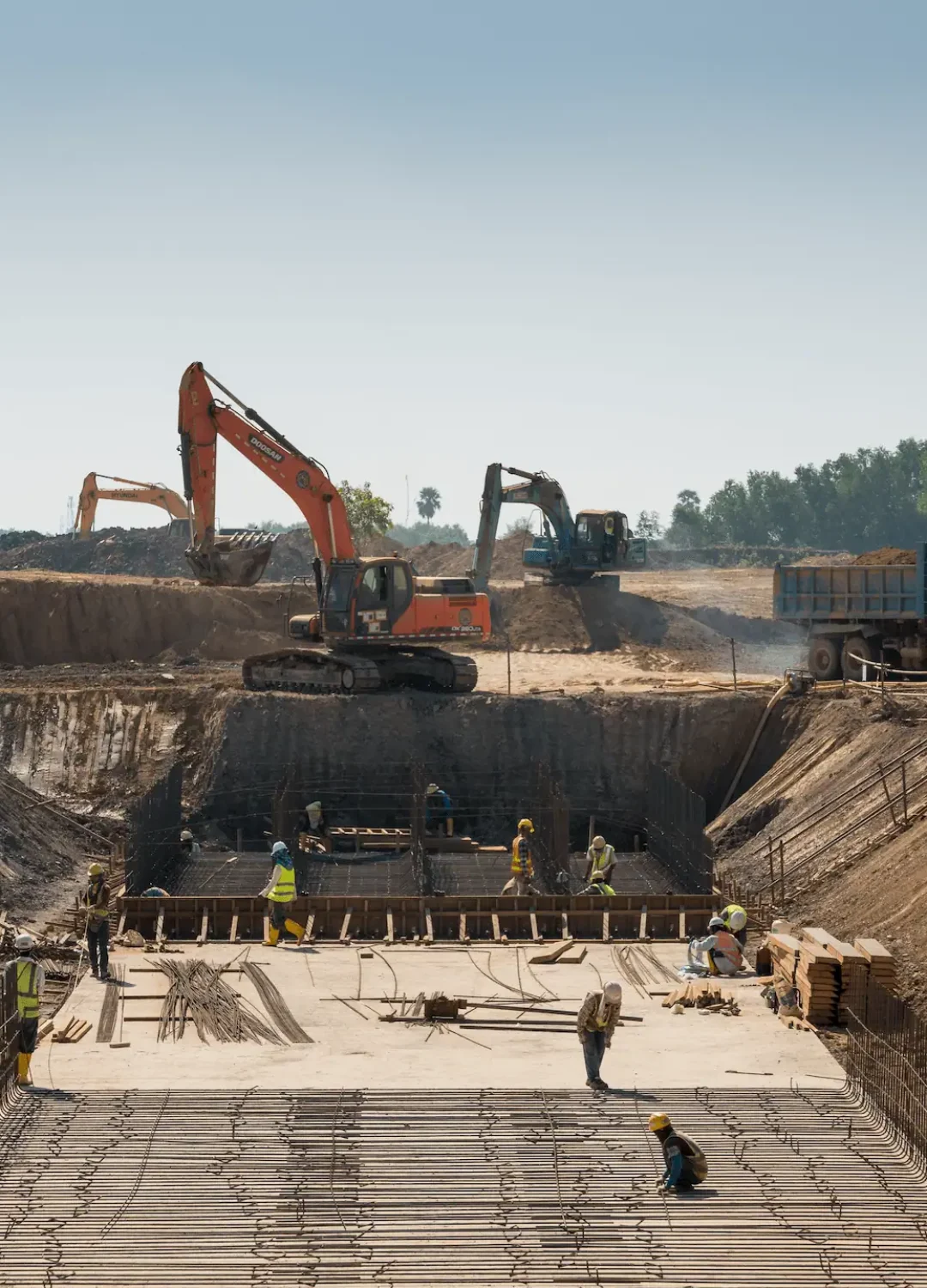 heavy-machines-construction-workers-working-building